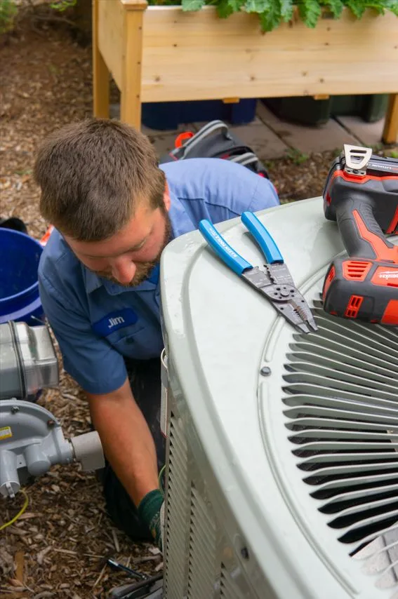 TR Miller HVAC technician performing ac repair