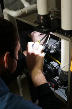 TR Miller technician performing electrical service