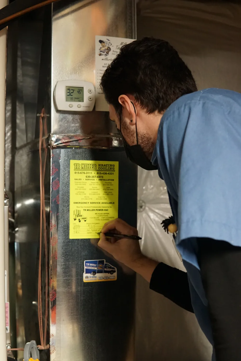 hvac technician servicing a home in the chicagoland suburbs