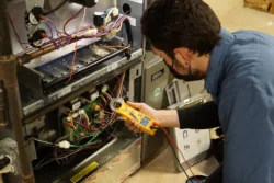 technician inspecting a residential ac unit