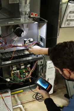 TR Miller technician servicing a home in the chicagoland area