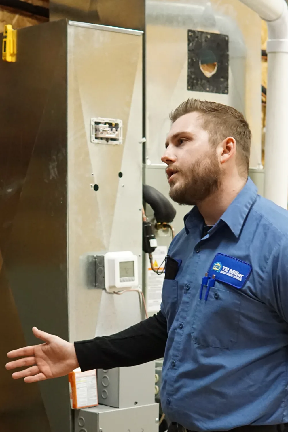tr miller hvac technician providing a furnace tune up in the chicagoland suburbs