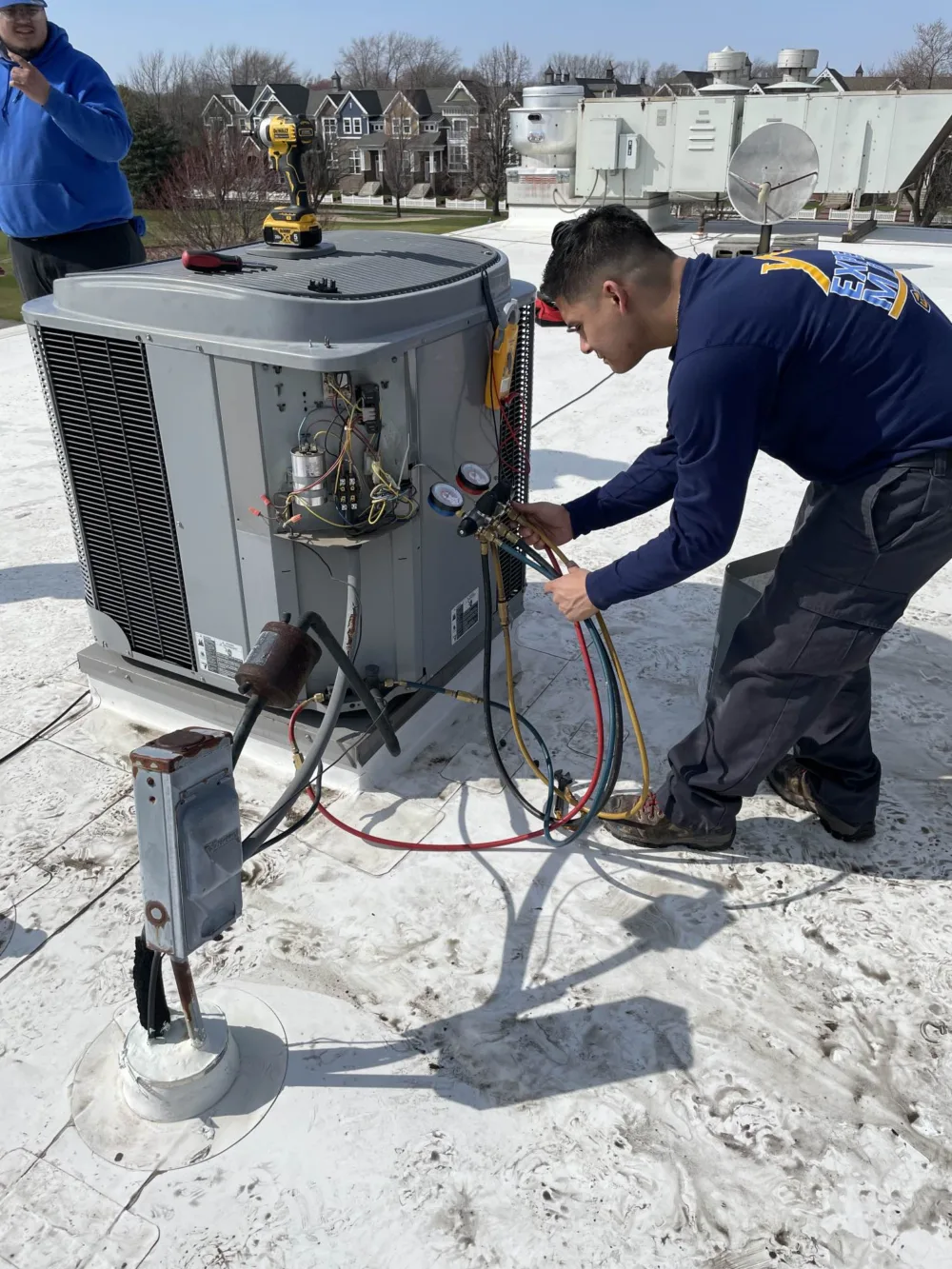 hvac technicians installing new residential ac units in the western Chicago suburbs
