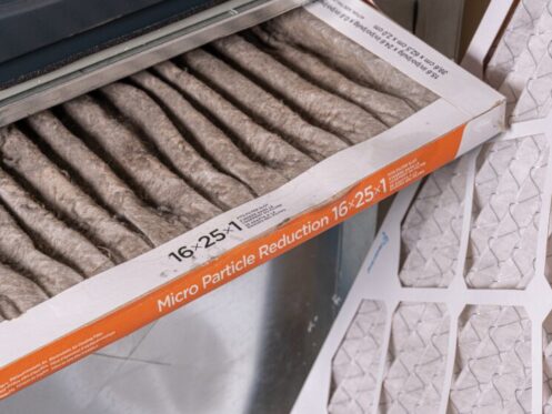 Replacing dirty furnace filter in home