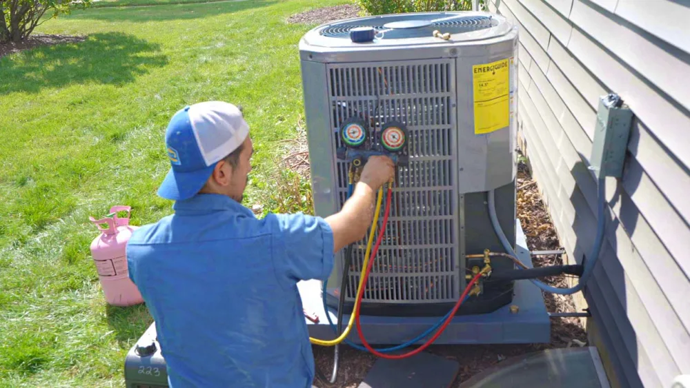 tr miller hvac technician performing ac repair in chicagoland suburbs