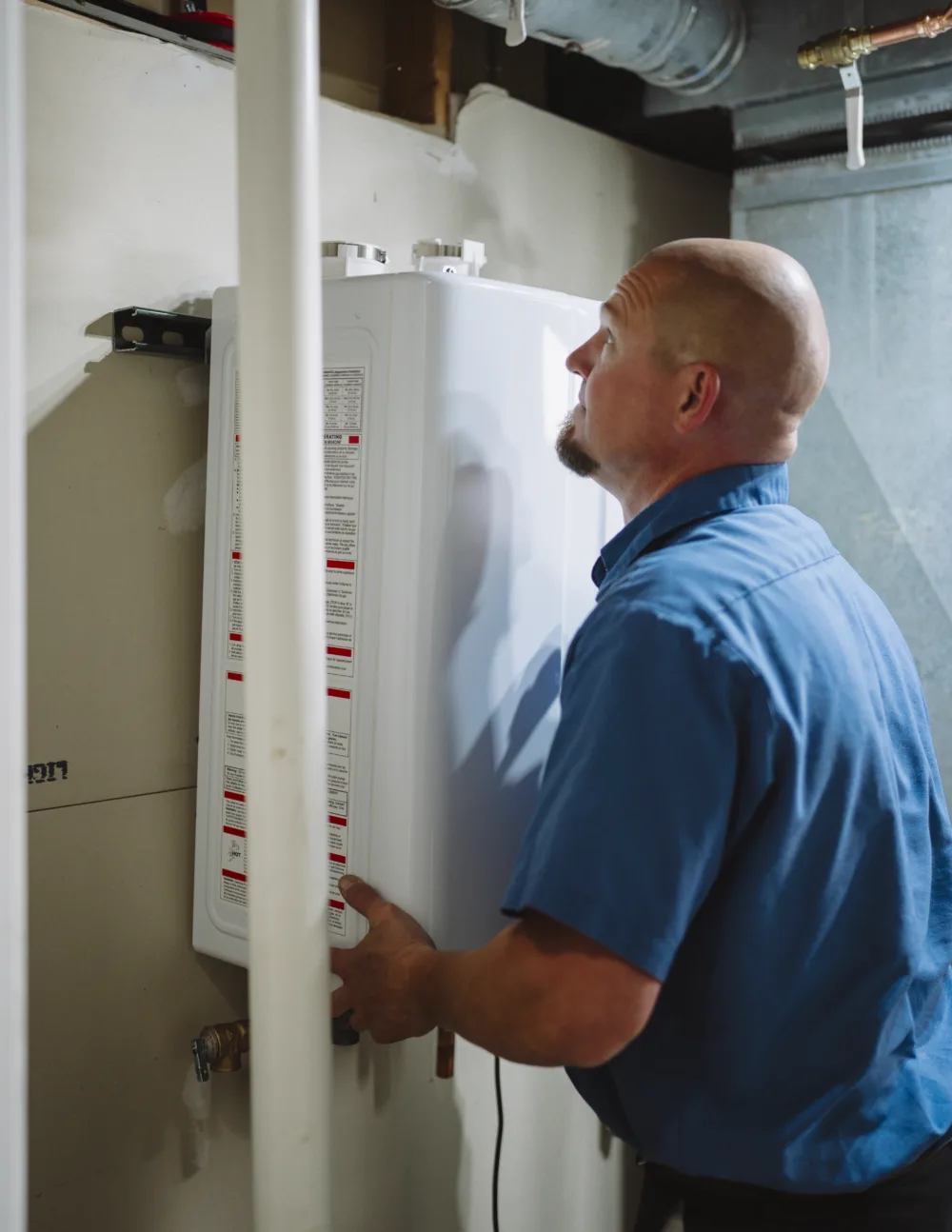 tr miller plumber installing a tankless water heater in southern chicago suburbs